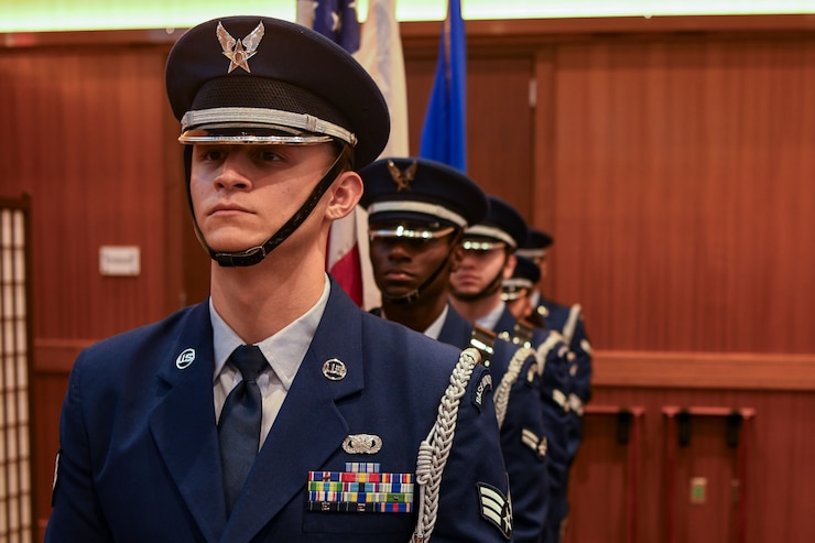 The 18th Wing honor guard stands in a line.