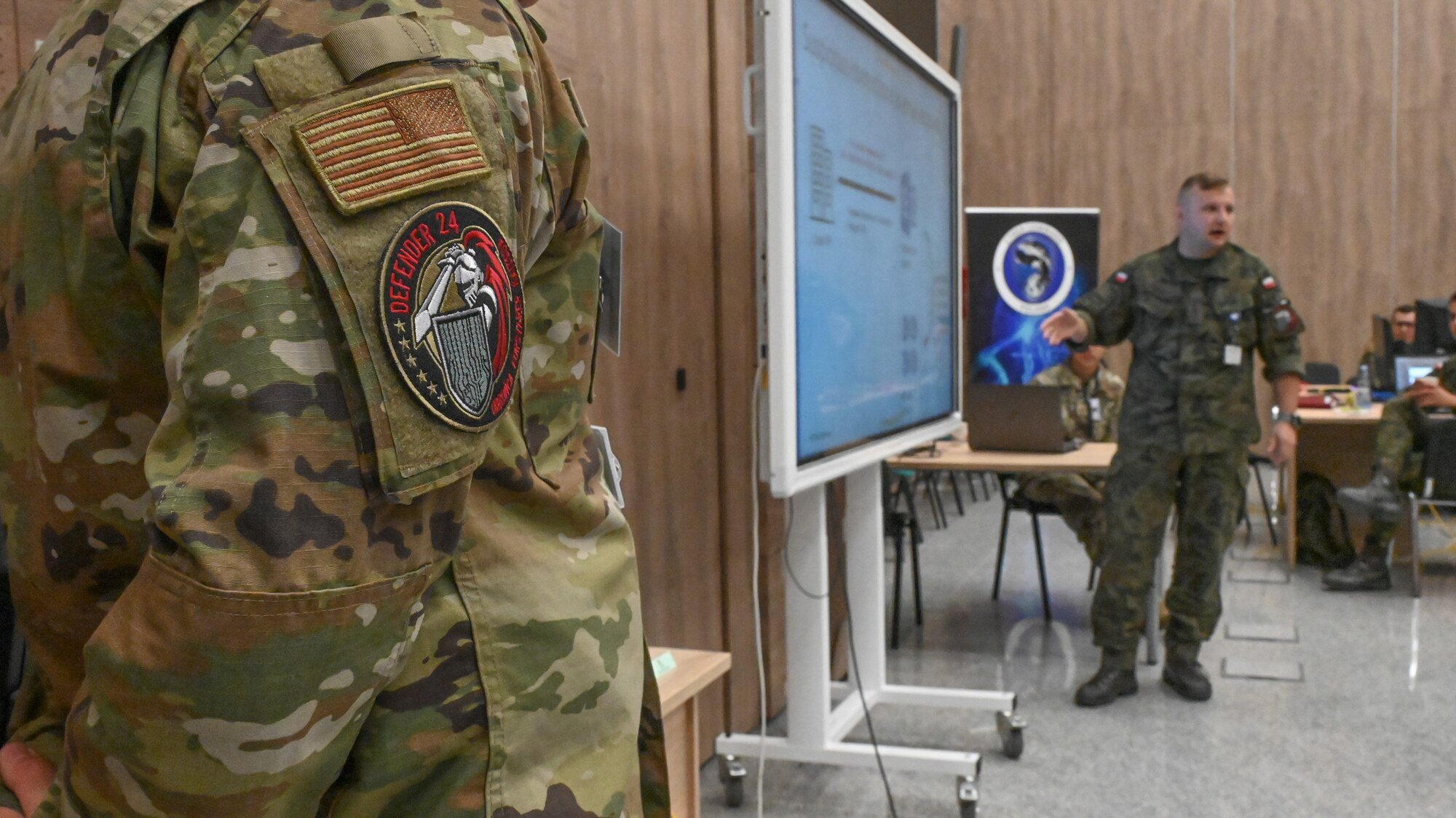 Cyber defenders from the Maryland Air National Guard partner with Poland Cyber Command service members for cyber training during a multinational cyber exercise as part of DEFENDER 24, May 8, 2024, in Warsaw, Poland.