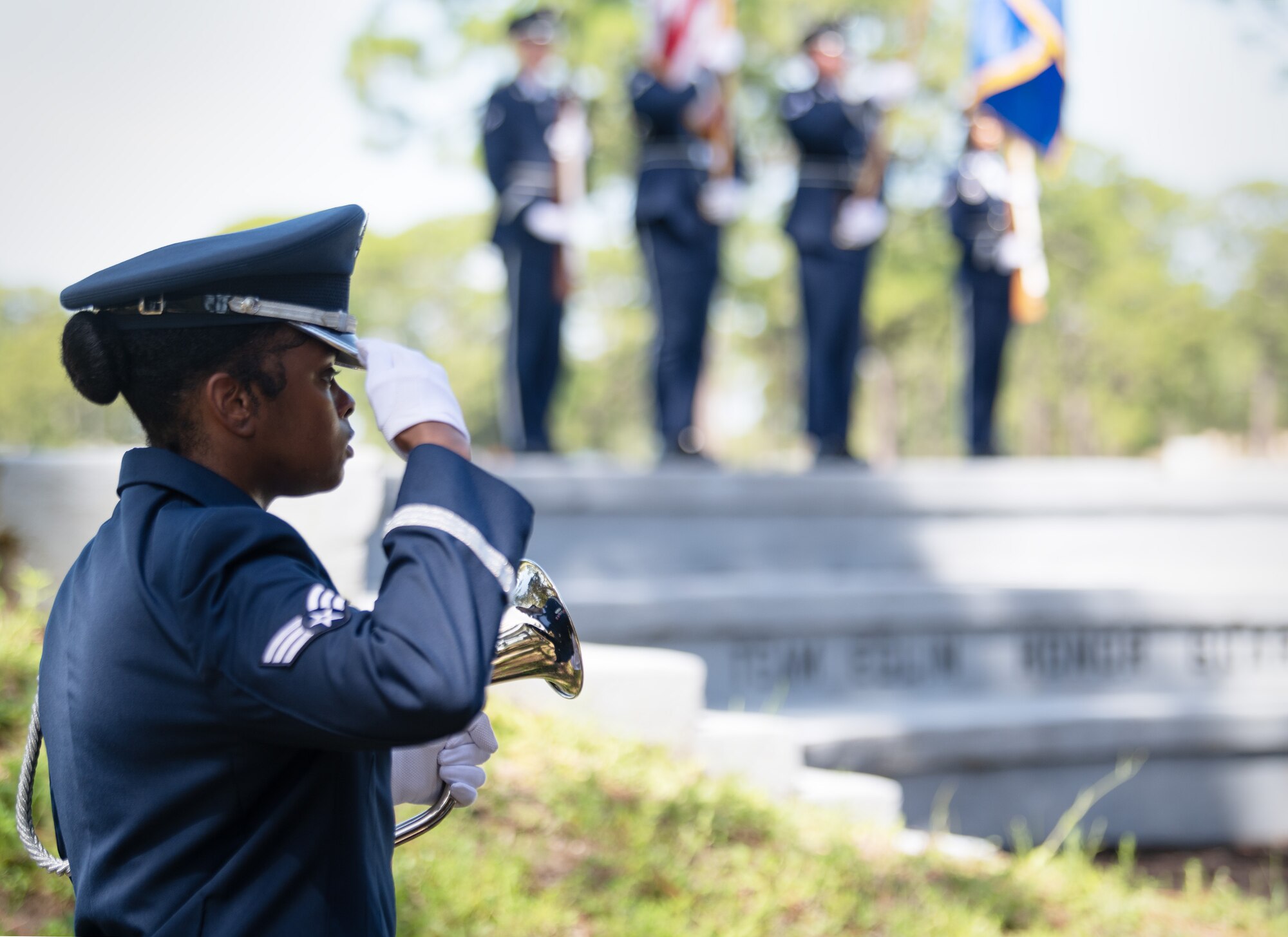 Senior Airman Mykleen Spears, ceremonial guardsman, salutes during a Team Eglin Honor Guard Graduation ceremony.