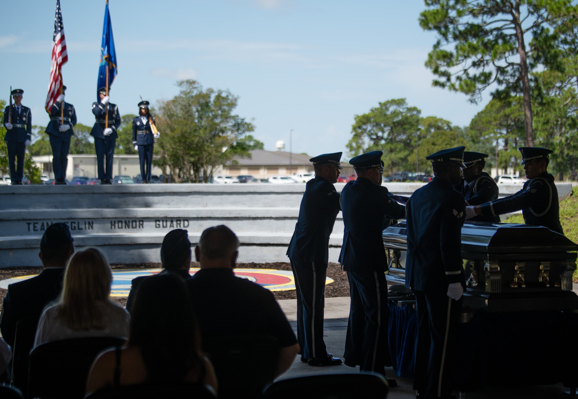 Friends, family and unit commanders observe a Team Eglin Honor Guard Graduation ceremony.