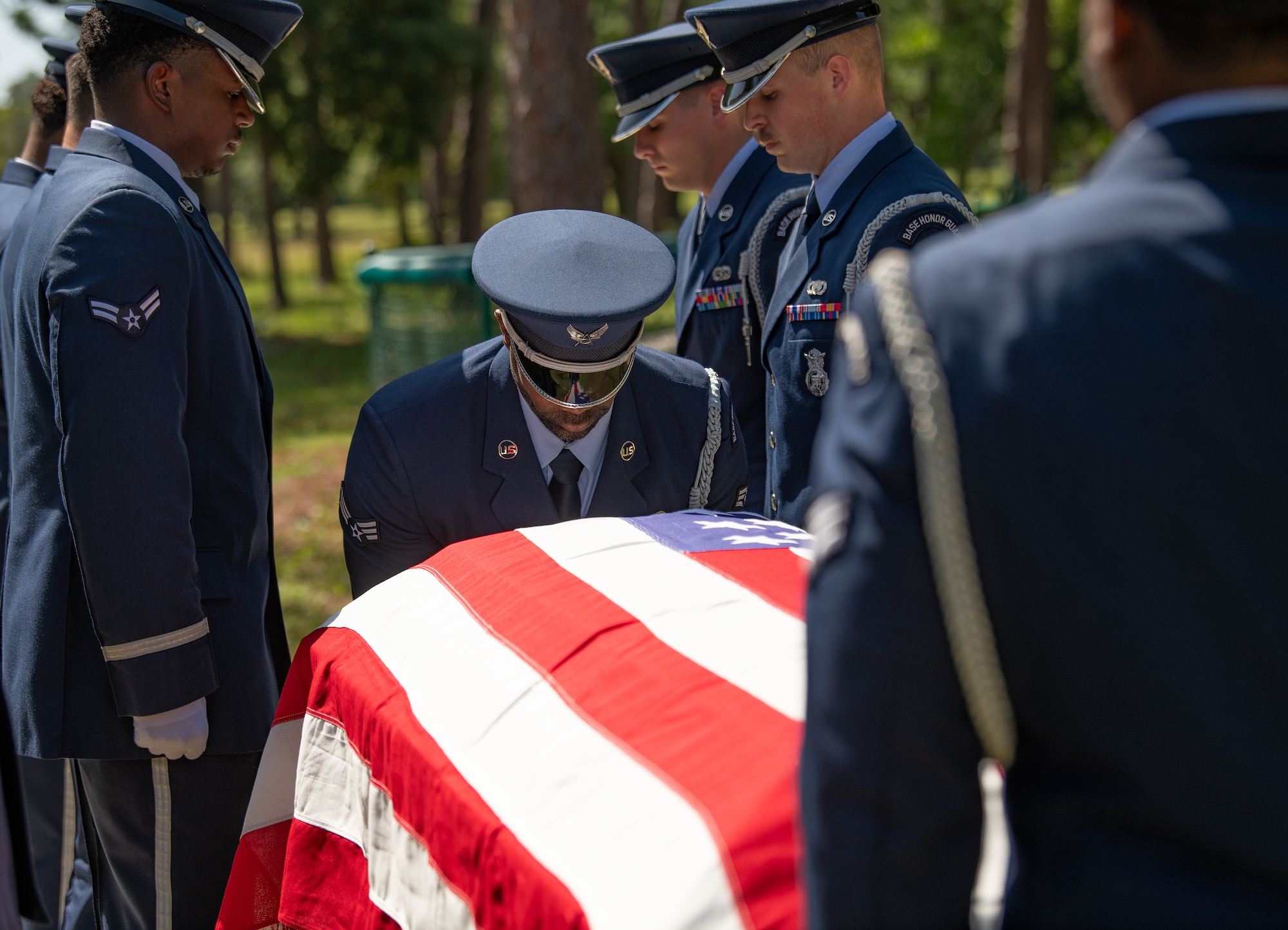Senior Airman Hector Morales Pizarro, ceremonial guardsman, holds a casket during a full-honors funeral demonstration at the Team Eglin Honor Guard Graduation ceremony.