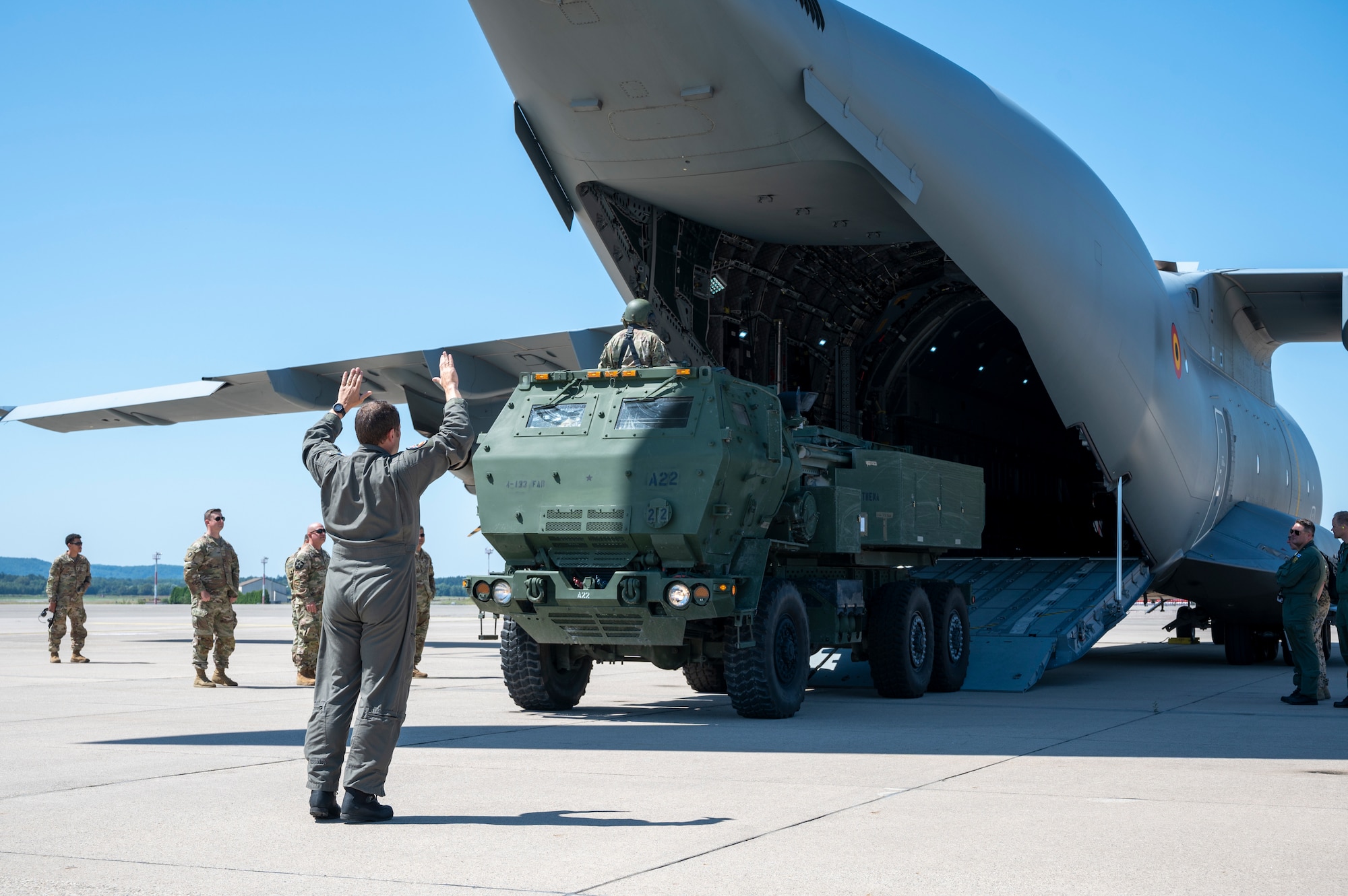 Belgian Air Component Warrant Officer Roly Hartwell, 20th Squadron Transport Conversion Unit loadmaster instructor, guides a U.S. Army M142 High Mobility Artillery Rocket System on a Belgian A400M Atlas during a HIMARS Rapid Insertion (HIRAIN) training at Ramstein Air Base, Germany, July 29, 2024.