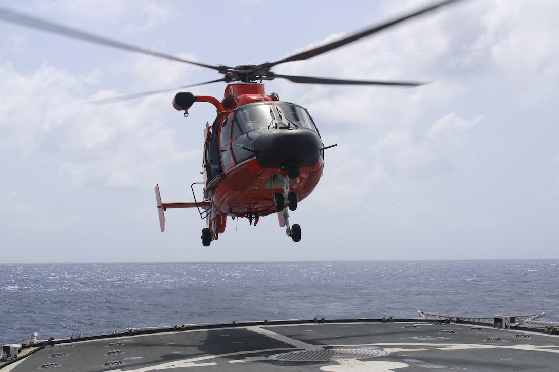 An embarked MH-65 Dolphin aircrew from the Coast Guard Helicopter Interdiction Tactical Squadron lands on the flight deck of Coast Guard Cutter Forward (WMEC 911), July 19, 2024, while underway in the Caribbean Sea. Forward conducted a 60-day Caribbean Sea patrol to interdict illegal drugs and apprehend suspected smugglers on the high seas in support of Joint Interagency Task Force – South. (U.S. Coast Guard photo)