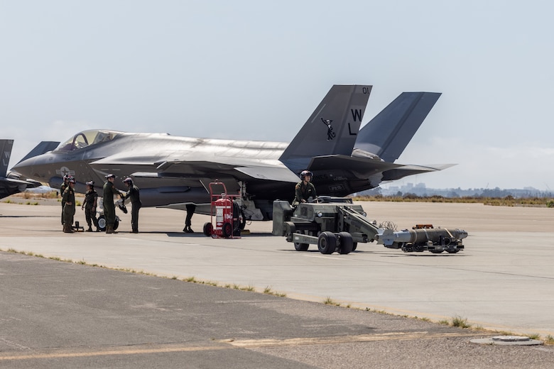 U.S. Marines with Marine Fighter Attack Squadron (VMFA) 311, Marine Aircraft Group 11, 3rd Marine Aircraft Wing, unload ordnance from a U.S. Marine Corps F-35C Lightning II aircraft assigned to VMFA-311, during a live ordnance training event at the Marine Corps Air Station Miramar combat aircraft loading area, California, July 25, 2024. This was the first time VMFA-311 conducted live ordnance operations independently and a milestone for the squadron, which declared initial operational capability on July 31, 2024. Achieving initial operational capability means that VMFA-311 has the operational F-35C aircraft, trained pilots, maintainers, and support equipment to self-sustain its mission essential tasks. (U.S. Marine Corps photo by Lance Cpl. Jennifer Sanchez)