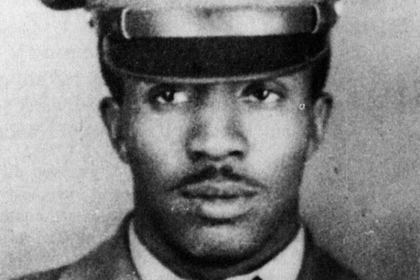 Black and white portrait photo of a soldier in uniform.