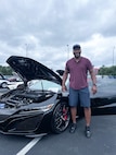 JOINT BASE ANACOSTIA-BOLLING, Washington, D.C. (July 30, 2024) - U.S. Navy Capt. Gregory Price, head of Nuclear Weapon Surety, Policy, and Compliance at Strategic Systems Programs (SSP) poses with his 2020 Acura NSX during SSP's summer picnic, Tuesday. This year's event for SSP staff and their families included food, games, a dunk tank, and a car show displaying cars owned by members of the SSP workforce. The picnic was organized by SSP’s Activity and Recreations Committee (SPARC), an all-volunteer team made up of military and civilians who fundraise and plan MWR events throughout the year. SSP is the Navy command that provides cradle-to-grave lifecycle support for the sea-based leg of the nation’s nuclear triad. (U.S. Navy Photo by Lt. Jennifer Bowman/Released)