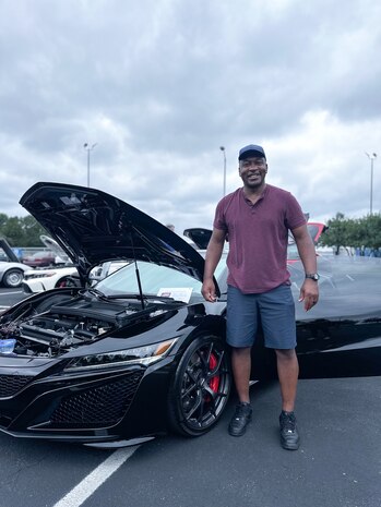 JOINT BASE ANACOSTIA-BOLLING, Washington, D.C. (July 30, 2024) - U.S. Navy Capt. Gregory Price, head of Nuclear Weapon Surety, Policy, and Compliance at Strategic Systems Programs (SSP) poses with his 2020 Acura NSX during SSP's summer picnic, Tuesday. This year's event for SSP staff and their families included food, games, a dunk tank, and a car show displaying cars owned by members of the SSP workforce. The picnic was organized by SSP’s Activity and Recreations Committee (SPARC), an all-volunteer team made up of military and civilians who fundraise and plan MWR events throughout the year. SSP is the Navy command that provides cradle-to-grave lifecycle support for the sea-based leg of the nation’s nuclear triad. (U.S. Navy Photo by Lt. Jennifer Bowman/Released)
