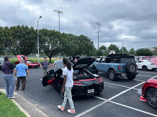 JOINT BASE ANACOSTIA-BOLLING, Washington, D.C. (July 30, 2024) - Strategic Systems Programs (SSP) hosts a car show during its annual command picnic, Tuesday. This year's event for SSP staff and their families included food, games, a dunk tank, and the car show which featured vehicles--old and new--owned by members of the SSP workforce. The picnic was organized by SSP’s Activity and Recreations Committee (SPARC), an all-volunteer team made up of military and civilians who fundraise and plan MWR events throughout the year. SSP is the Navy command that provides cradle-to-grave lifecycle support for the sea-based leg of the nation’s nuclear triad. (U.S. Navy Photo by Lt. Jennifer Bowman/Released)