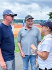 JOINT BASE ANACOSTIA-BOLLING, Washington, D.C. (July 30, 2024) - Strategic Systems Programs (SSP) Director Vice Adm. Johnny Wolfe Jr. (left) visits with employees like Susan Filz (right) from the command's Enterprise Business Office during the command's annual picnic Tuesday. This year's event for SSP staff and their families included food, games, a dunk tank, and the car show which featured vehicles--old and new--owned by members of the SSP workforce. The picnic was organized by SSP’s Activity and Recreations Committee (SPARC), an all-volunteer team made up of military and civilians who fundraise and plan MWR events throughout the year. SSP is the Navy command that provides cradle-to-grave lifecycle support for the sea-based leg of the nation’s nuclear triad. (U.S. Navy Photo by Lt. Jennifer Bowman/Released)
