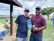 JOINT BASE ANACOSTIA-BOLLING, Washington, D.C. (July 30, 2024) - Strategic Systems Programs (SSP) Director Vice Adm. Johnny Wolfe Jr. (left) awards Capt. Gregory Price (right) 'People's Choice' for his 2020 Acura NSX after votes were tallied  during the command's annual picnic Tuesday. This year's event for SSP staff and their families included food, games, a dunk tank, and the car show which featured vehicles--old and new--owned by members of the SSP workforce. The picnic was organized by SSP’s Activity and Recreations Committee (SPARC), an all-volunteer team made up of military and civilians who fundraise and plan MWR events throughout the year. SSP is the Navy command that provides cradle-to-grave lifecycle support for the sea-based leg of the nation’s nuclear triad. (U.S. Navy Photo by Lt. Jennifer Bowman/Released)