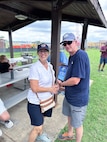 JOINT BASE ANACOSTIA-BOLLING, Washington, D.C. (July 30, 2024) - Strategic Systems Programs (SSP) Director Vice Adm. Johnny Wolfe Jr. (right) awards Ms. Susan Filz (left) 'Best in Show-Truck' for her 1955 Ford F-100 pickup truck after votes were tallied  during the command's annual picnic Tuesday. This year's event for SSP staff and their families included food, games, a dunk tank, and the car show which featured vehicles--old and new--owned by members of the SSP workforce. The picnic was organized by SSP’s Activity and Recreations Committee (SPARC), an all-volunteer team made up of military and civilians who fundraise and plan MWR events throughout the year. SSP is the Navy command that provides cradle-to-grave lifecycle support for the sea-based leg of the nation’s nuclear triad. (U.S. Navy Photo by Lt. Jennifer Bowman/Released)