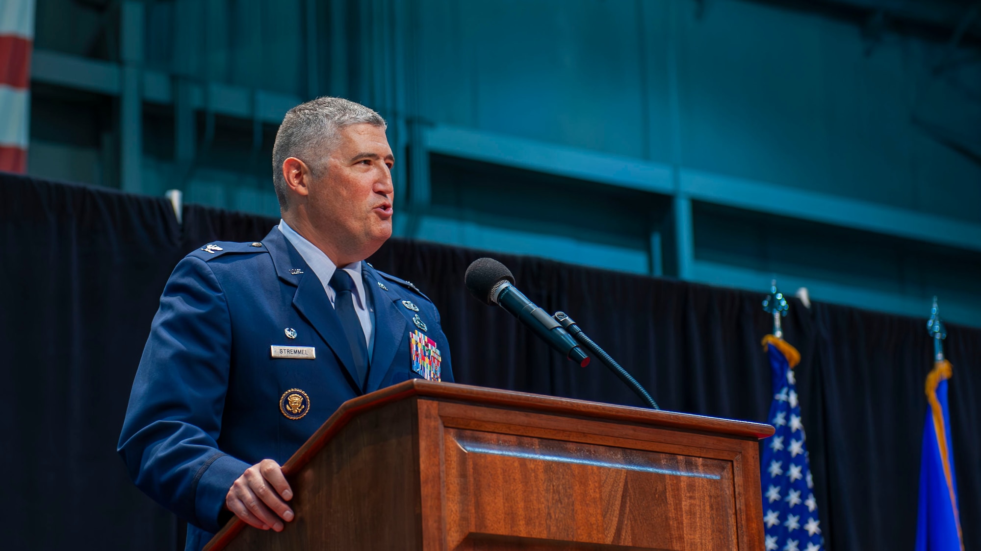 Col. Stremmel speaking at podium