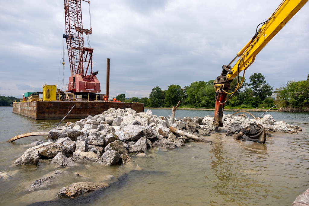 Contractors for the U.S. Army Corps of Engineers Pittsburgh District use various floating barges to drill, demolish and remove the fixed-crest dam at the Monongahela River Locks and Dam 3 in Elizabeth, Pennsylvania, July 29, 2024.