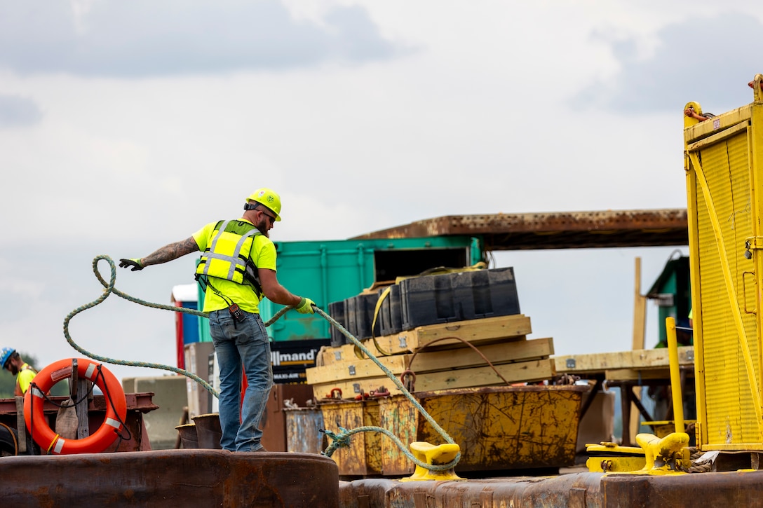 Contractors for the U.S. Army Corps of Engineers Pittsburgh District use various floating barges to drill, demolish and remove the fixed-crest dam at the Monongahela River Locks and Dam 3 in Elizabeth, Pennsylvania, July 29, 2024.