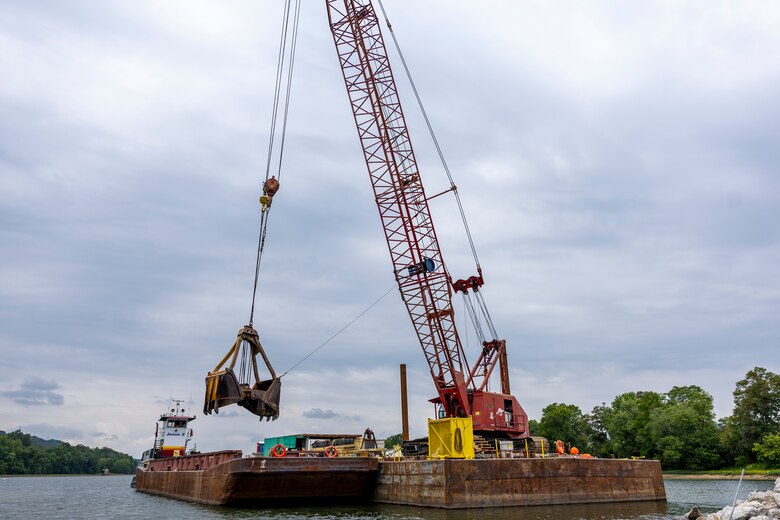 Contractors for the U.S. Army Corps of Engineers Pittsburgh District use various floating barges to drill, demolish and remove the fixed-crest dam at the Monongahela River Locks and Dam 3 in Elizabeth, Pennsylvania, July 29, 2024.