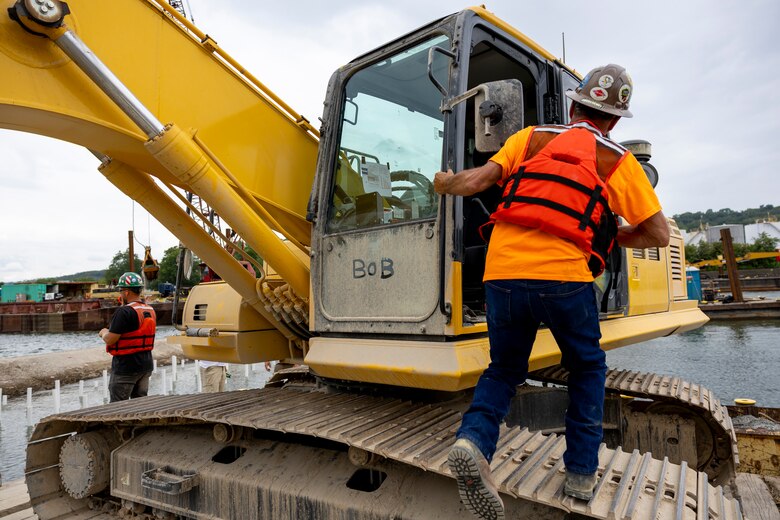 Contractors for the U.S. Army Corps of Engineers Pittsburgh District use various floating barges to drill, demolish and remove the fixed-crest dam at the Monongahela River Locks and Dam 3 in Elizabeth, Pennsylvania, July 29, 2024.