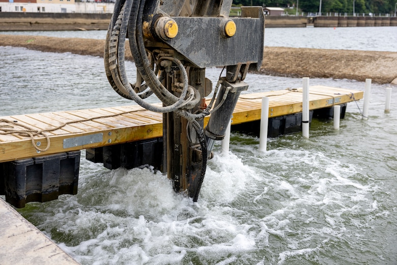 Contractors for the U.S. Army Corps of Engineers Pittsburgh District use various floating barges to drill, demolish and remove the fixed-crest dam at the Monongahela River Locks and Dam 3 in Elizabeth, Pennsylvania, July 29, 2024.