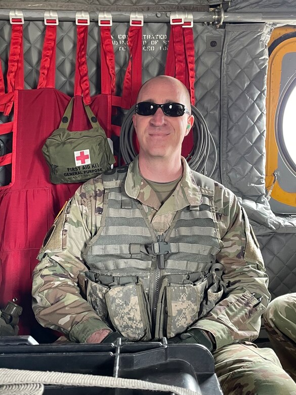 Trey Burchfield flying in the Chinook Helicopter