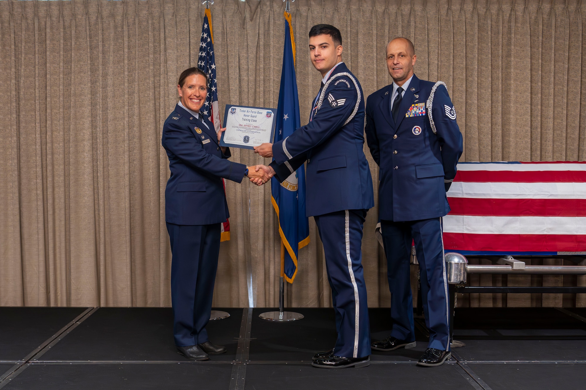 man receives graduation certificate