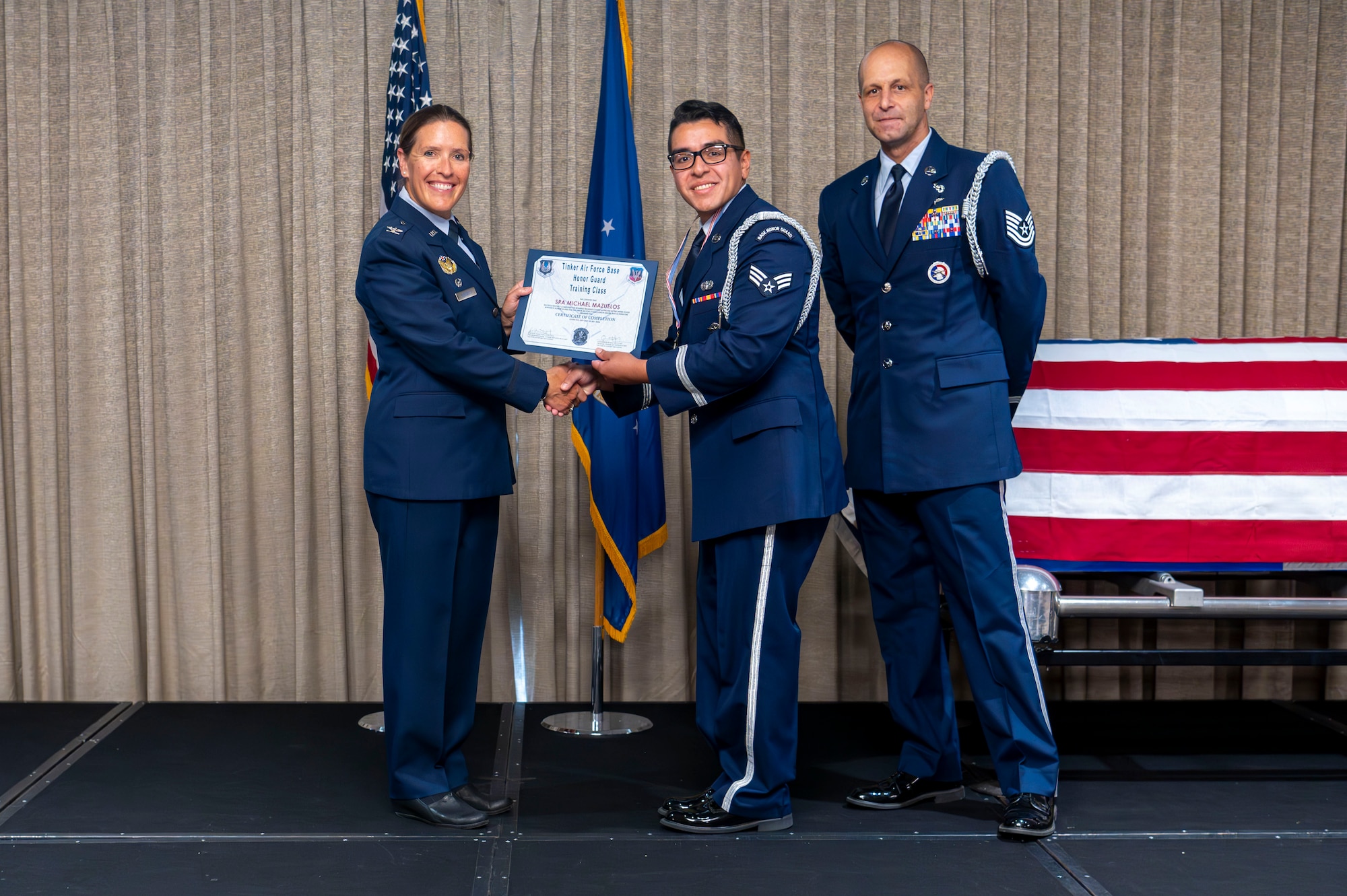 man receives graduation certificate