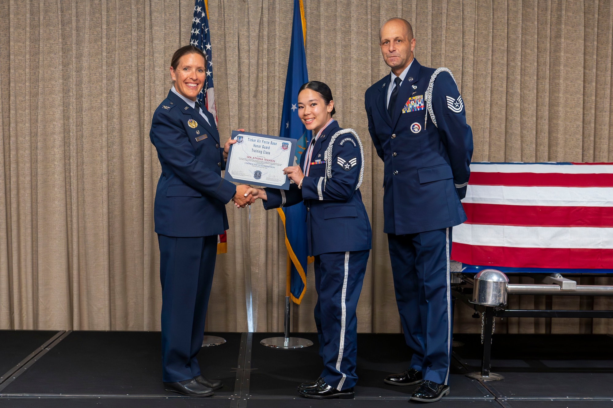 woman receives graduation certificate