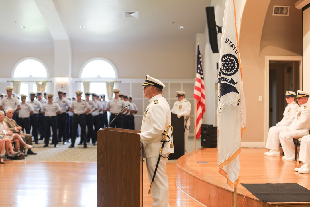 Cmdr. Aaron Kowalczk, incoming commanding officer of Coast Guard Cutter Reliance (WMEC 615), delivers his remarks, July 25, during a change-of-command ceremony at Naval Air Station Pensacola, Florida. The change-of-command ceremony is a time-honored tradition that serves to formally demonstrate the continuity of authority within a command in front of the crew and esteemed guests. (U.S Coast Guard photo by Petty Officer 2nd Class Tyler Goldberg)