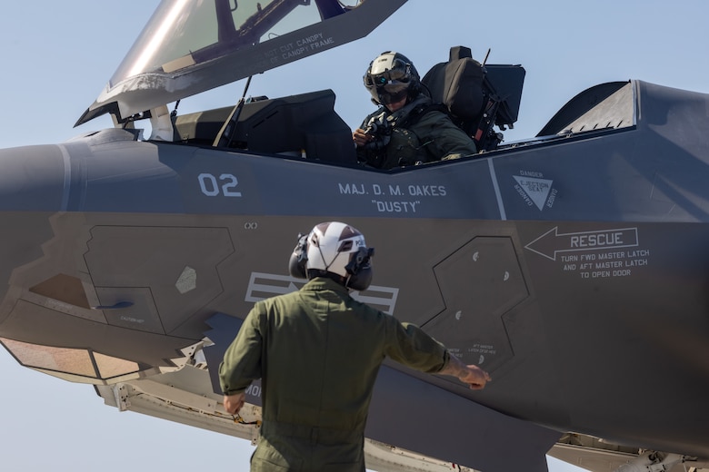 U.S. Marine Corps Cpl. Larry Casas, a fixed-wing aircraft mechanic with Marine Fighter Attack Squadron (VMFA) 311, Marine Aircraft Group 11, 3rd Marine Aircraft Wing, directs a U.S. Marine Corps F-35C Lightning II aircraft during a live ordnance training event at the Marine Corps Air Station Miramar combat aircraft loading area, California, July 25, 2024. This was the first time VMFA-311 conducted live ordnance operations independently and a milestone for the squadron, which declared initial operational capability on July 31, 2024. Achieving initial operational capability means that VMFA-311 has the operational F-35C aircraft, trained pilots, maintainers, and support equipment to self-sustain its mission essential tasks. (U.S. Marine Corps photo by Lance Cpl. Jennifer Sanchez)