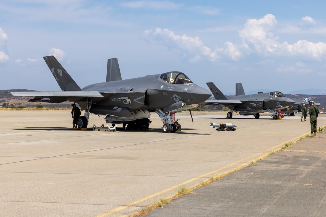 U.S. Marine Corps F-35C Lightning II aircraft assigned to Marine Fighter Attack Squadron (VMFA) 311, Marine Aircraft Group 11, 3rd Marine Aircraft Wing, are staged during a live ordnance training event at the Marine Corps Air Station Miramar combat aircraft loading area, California, July 24, 2024. This was the first time VMFA-311 conducted live ordnance operations independently and a milestone for the squadron, which declared initial operational capability on July 31, 2024. Achieving initial operational capability means that VMFA-311 has the operational F-35C aircraft, trained pilots, maintainers, and support equipment to self-sustain its mission essential tasks. (U.S. Marine Corps photo by Lance Cpl. Jennifer Sanchez)