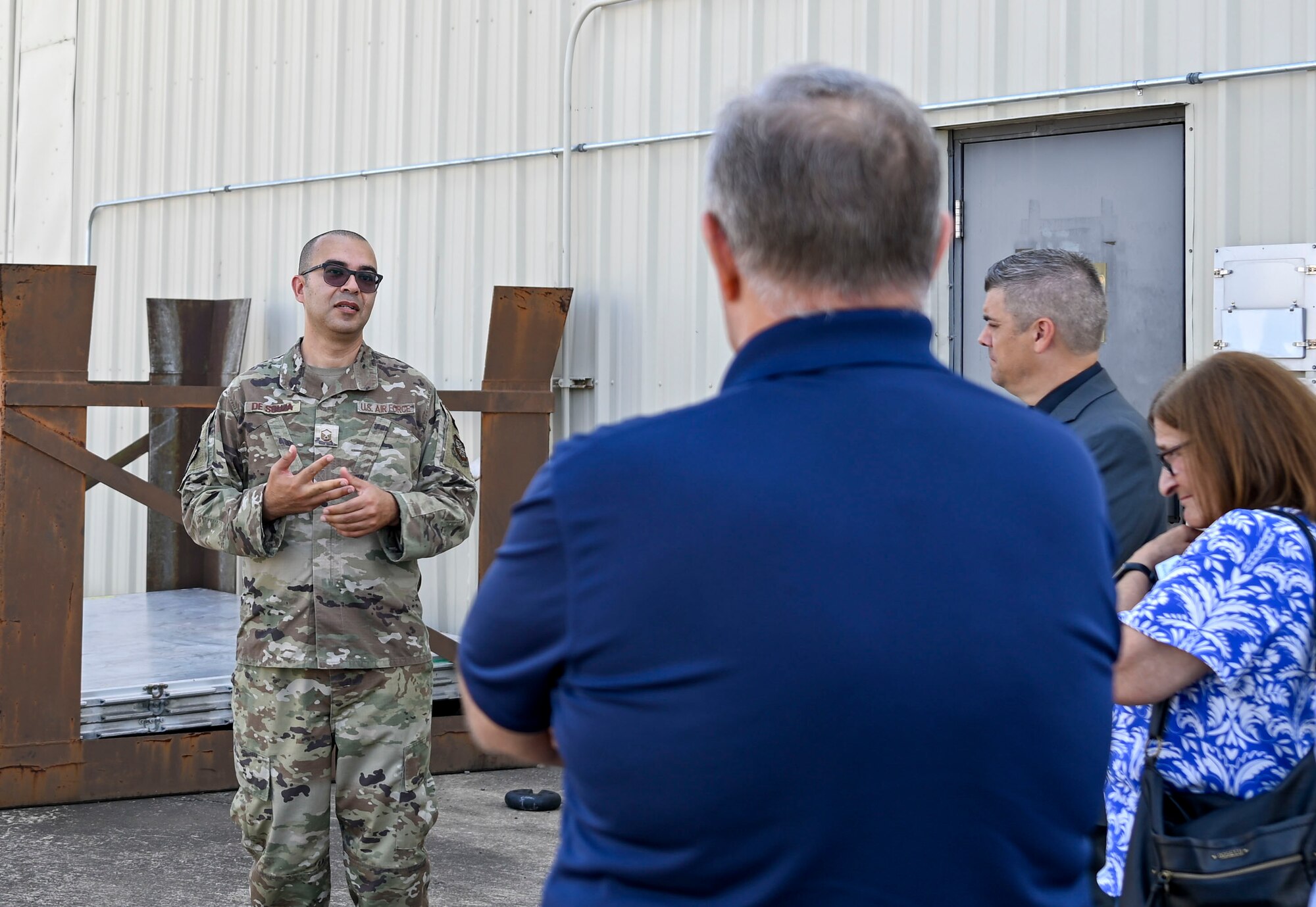 A man speaks to a group of people.