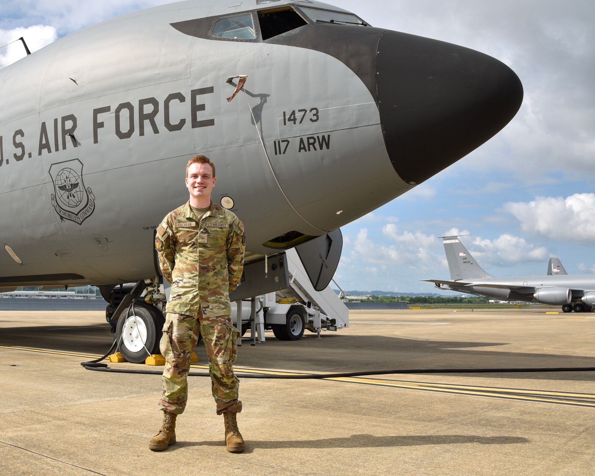 Airman 1st Class Brady Cochran poses in front of a KC-135R at Sumpter Smith Joint National Guard Base, Alabama, May 04, 2024.