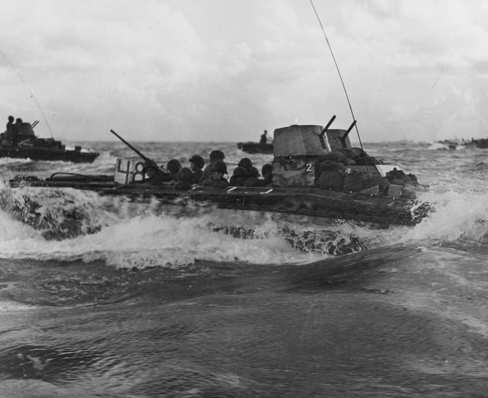 LVT carrying assault troops from Saipan to Tinian.  More than half of the 140 LVTs used to Land the assault force were crewed by the U.S. Army.  The Tinian invasion is the only major amphibious assault to be launched from land by LVTs that transited the three nautical miles from Saipan to Tinian.