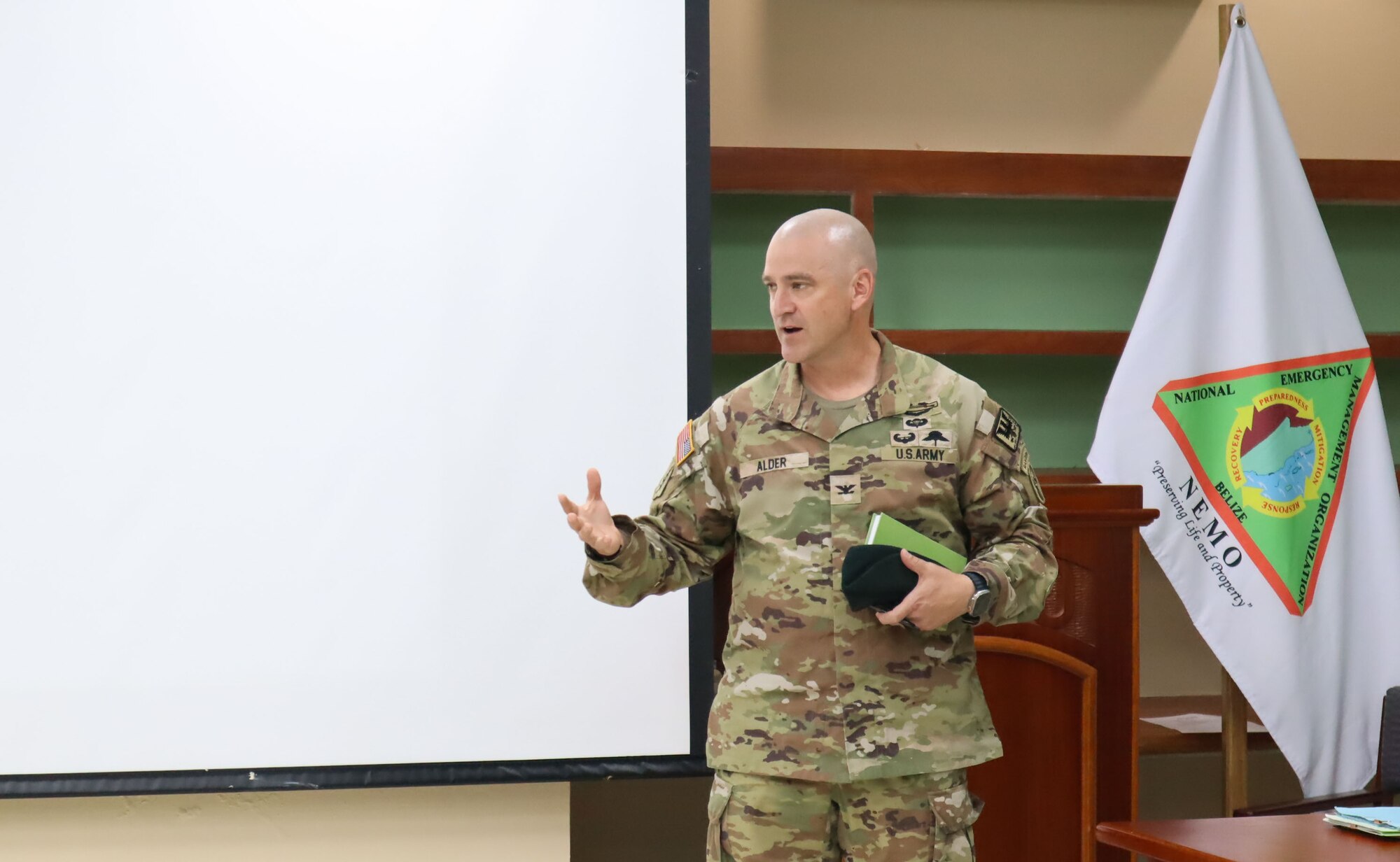 A photo of a Soldier talking to a group.