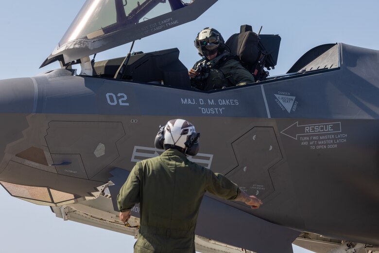 U.S. Marine Corps Cpl. Larry Casas, a fixed-wing aircraft mechanic with Marine Fighter Attack Squadron (VMFA) 311, Marine Aircraft Group 11, 3rd Marine Aircraft Wing, directs a U.S. Marine Corps F-35C Lightning II aircraft during a live ordnance training event at the Marine Corps Air Station Miramar combat aircraft loading area, California, July 25, 2024. This was the first time VMFA-311 conducted live ordnance operations independently and a milestone for the squadron, which declared initial operational capability on July 31, 2024. Achieving initial operational capability means that VMFA-311 has the operational F-35C aircraft, trained pilots, maintainers, and support equipment to self-sustain its mission essential tasks. (U.S. Marine Corps photo by Lance Cpl. Jennifer Sanchez)