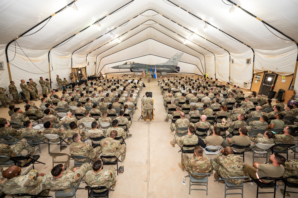 Chief Master Sgt. of the Air Force David Flosi speaks to Airmen from the 378th Air Expeditionary Wing during an all-call at an undisclosed location within the U.S. Central Command area of responsibility, July 23, 2024. During the all-call, he stressed that to achieve seamless readiness for Airmen on day one of their deployment, that it is critical to bring the skills and knowledge they gained over that time back home and to provide a platform to execute that feedback. (U.S. Air Force photo)