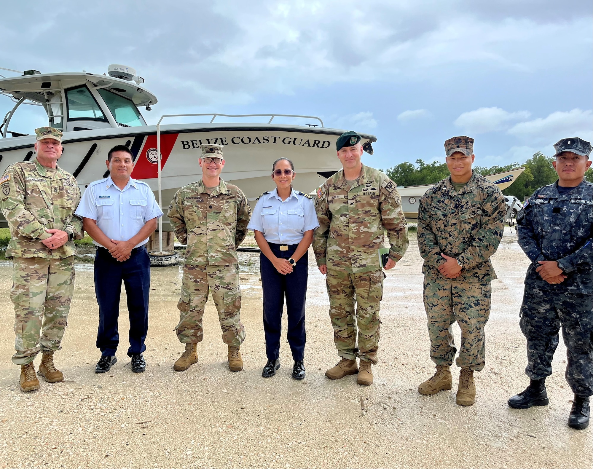 A photo of military members posing for a picture.