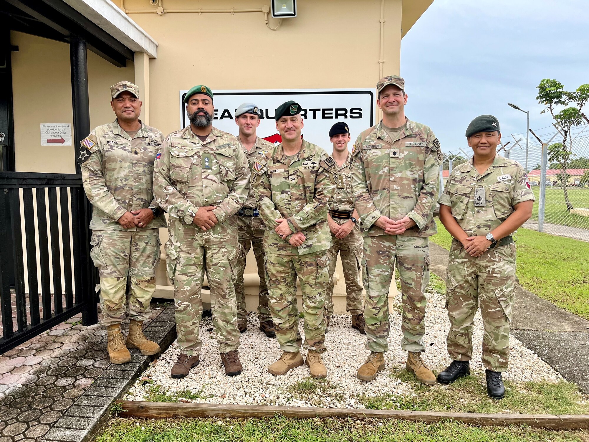 A photo of military members posing for a picture.