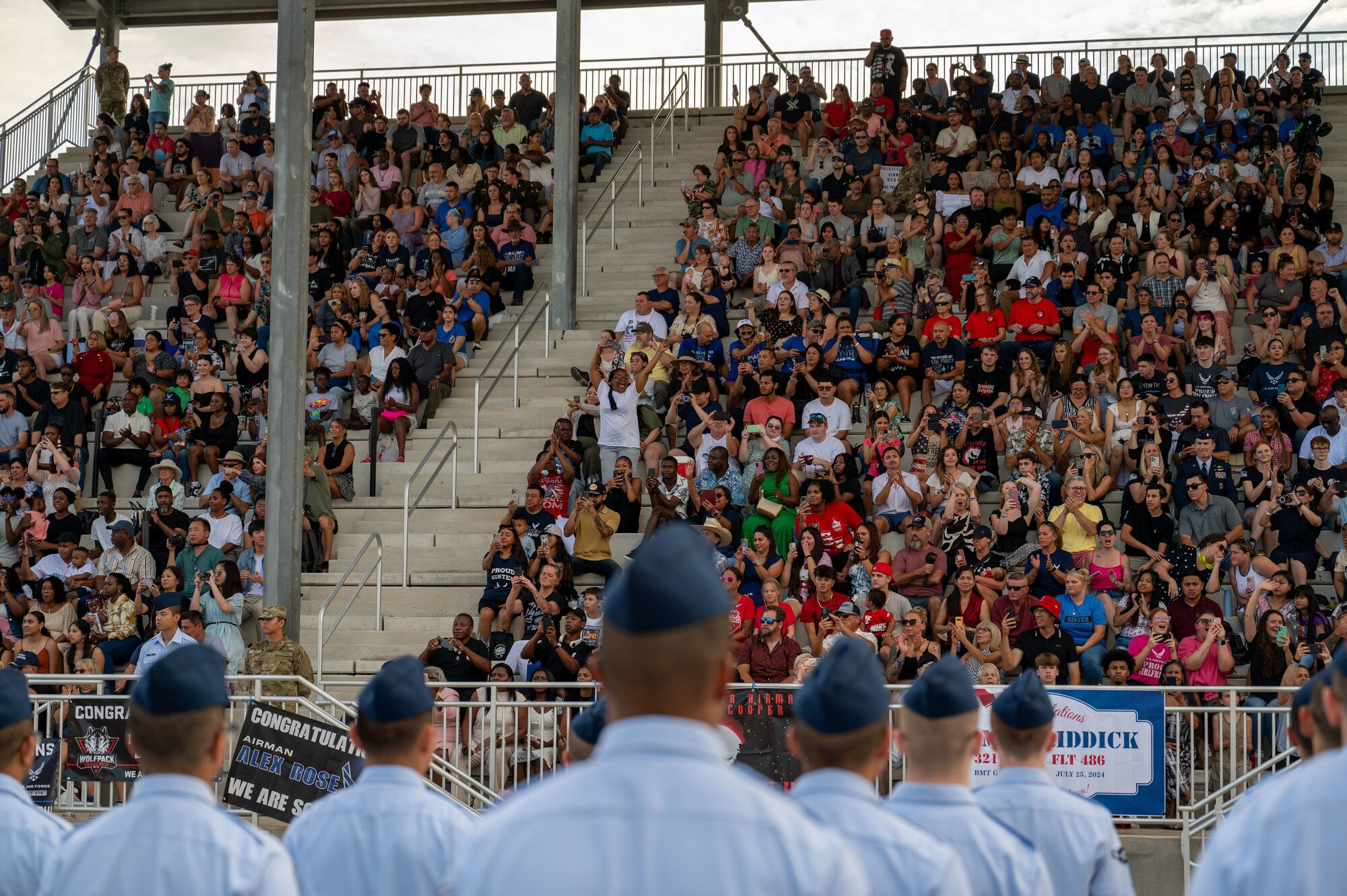 More than 700 Airmen assigned to Flights 472-487, receive their Airman’s coin during the 737th Training Group’s Coin and Retreat Ceremony, at Joint Base San Antonio-Lackland, Texas, July 24, 2024. The ceremony is one of three U.S. Air Force Basic Military Training graduation events and signifies the transition from trainee to Airman. Lt. Col. Rodolfo Orozco, 321st Training Squadron commander, and Chief Master Sergeant Valeria Andrade, 321 TRS Senior Enlisted Leader, were the guest speakers for the ceremony. The 37th Training Wing, known as “Gateway to the Air Force” is home to BMT. (U.S. Air Force photo by Ava Leone)