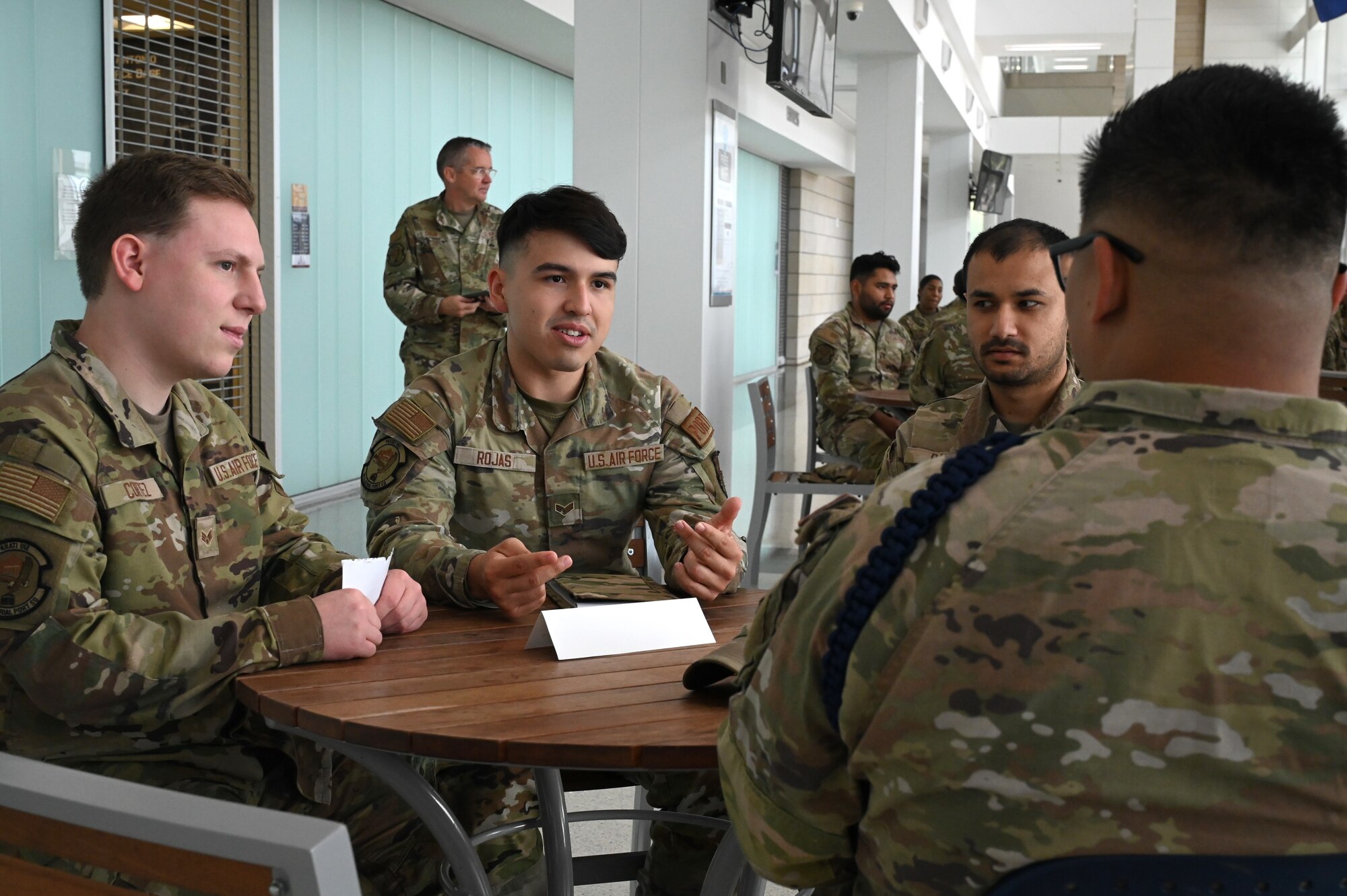 Photo of Senior Airman Jorge Rojas, 74th Aerial Port Squadron air transportation specialist, asking a question during a speed mentoring event at Wilford Hall Ambulatory Surgical Center on Joint Base San Antonio-Lackland, Texas