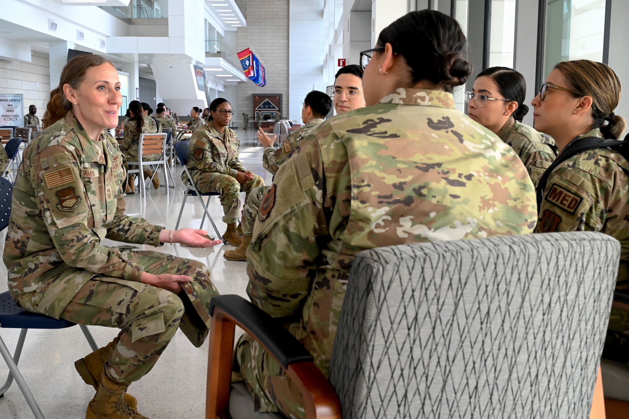 Photo of Chief Master Sgt. Amanda Hamilton, 433rd Airlift Wing functional manager, speaking to a group of Airmen during a speed mentoring event at Wilford Hall Ambulatory Surgical Center on Joint Base San Antonio-Lackland, Texas