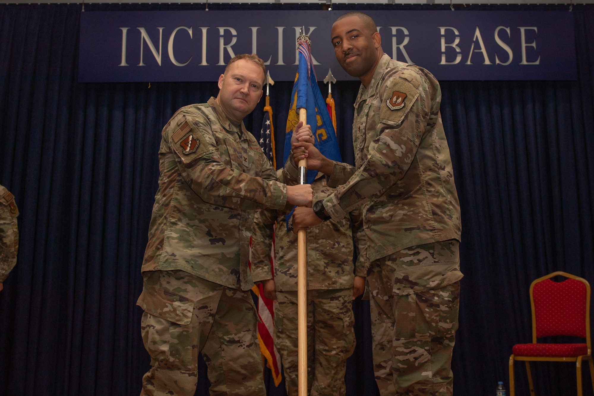 U.S. Air Force Maj. William Glover, 39th Communications Squadron commander, receives the unit guidon from Col. Jason Rossi, 39th Mission Support Group commander during a change of command ceremony.
