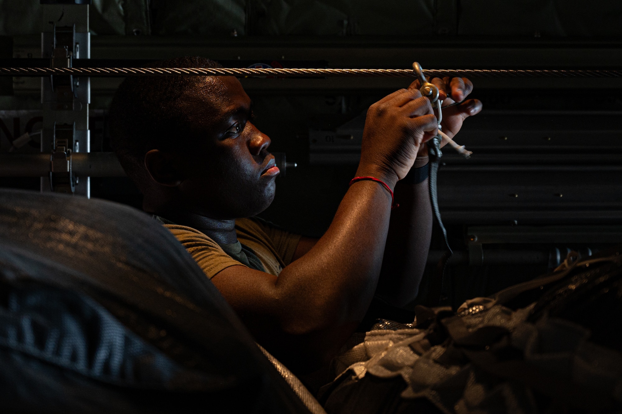 A U.S. Air Force loadmaster Airman inspects humanitarian aid destined for Gaza aboard a C-130J Super Hercules at an undisclosed location within the U.S. Central Command area of responsibility, April 18, 2024. In addition to the loadmaster inspection, each pallet is parachute rigged and inspected by U.S. Army Central Command Soldiers who specialize in rigging supplies for airdrop to ensure they are prepared to drop as safely as possible.(U.S. Air Force photo)