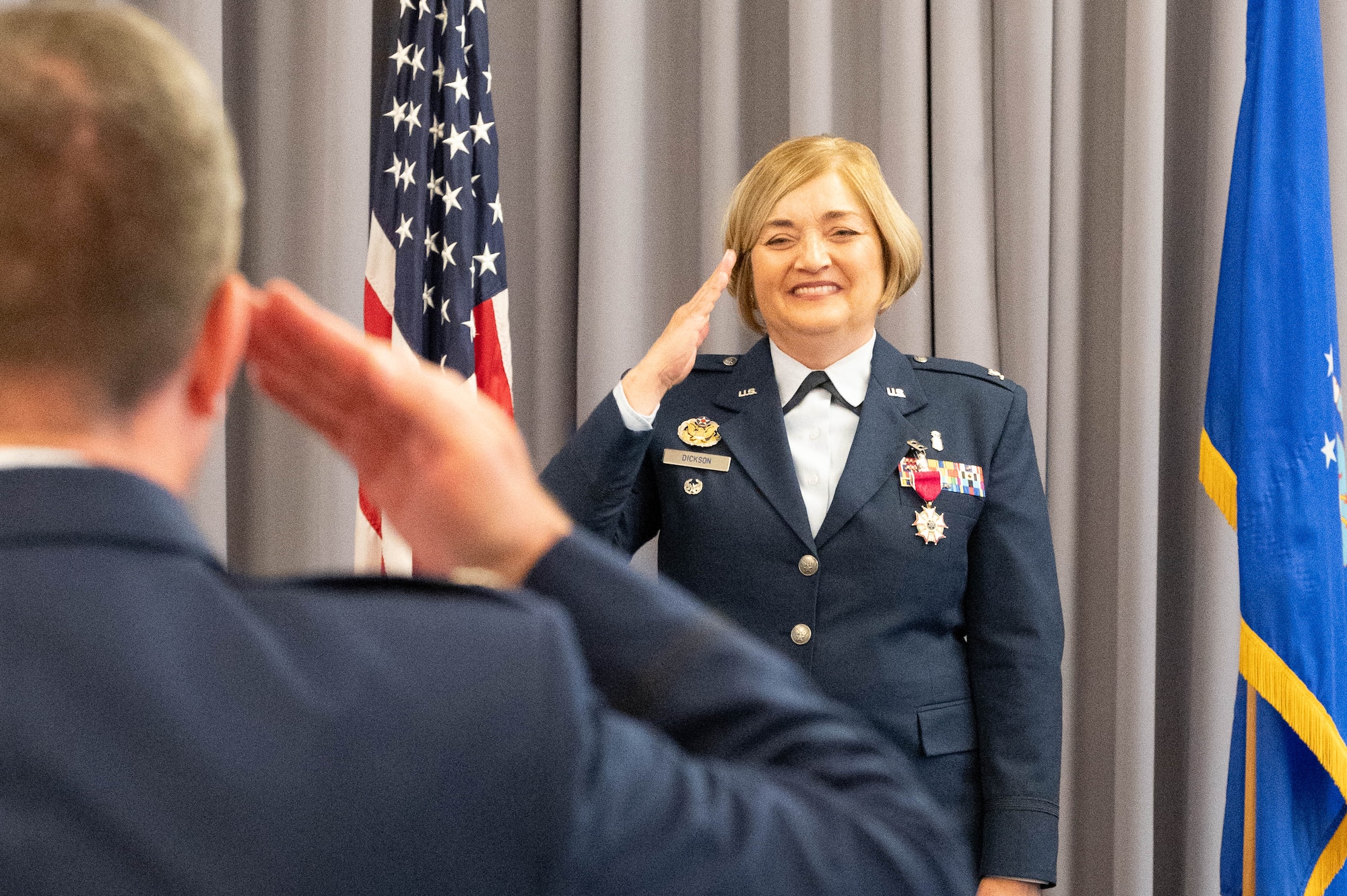U.S. Air Force Col. Peggy Dickson, outgoing 436th Medical Group commander, accepts a final salute from her unit during a change of command ceremony at Dover Air Force Base, Delaware, May 30, 2024. The ceremony saw Dickson relinquish command to Col. Jamison Elder. (U.S. Air Force photo by Mauricio Campino)