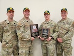 U.S. Army Soldiers and Airmen with the small arms readiness training section, Vermont National Guard, pose with their awards after the Winston P. Wilson Small Arms Championship