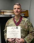 U.S. Army Col. Michael Korczykowski, Commander, Vermont Medical Detachment, Vermont National Guard, poses with his Order of Military Medical Merit medal and award.