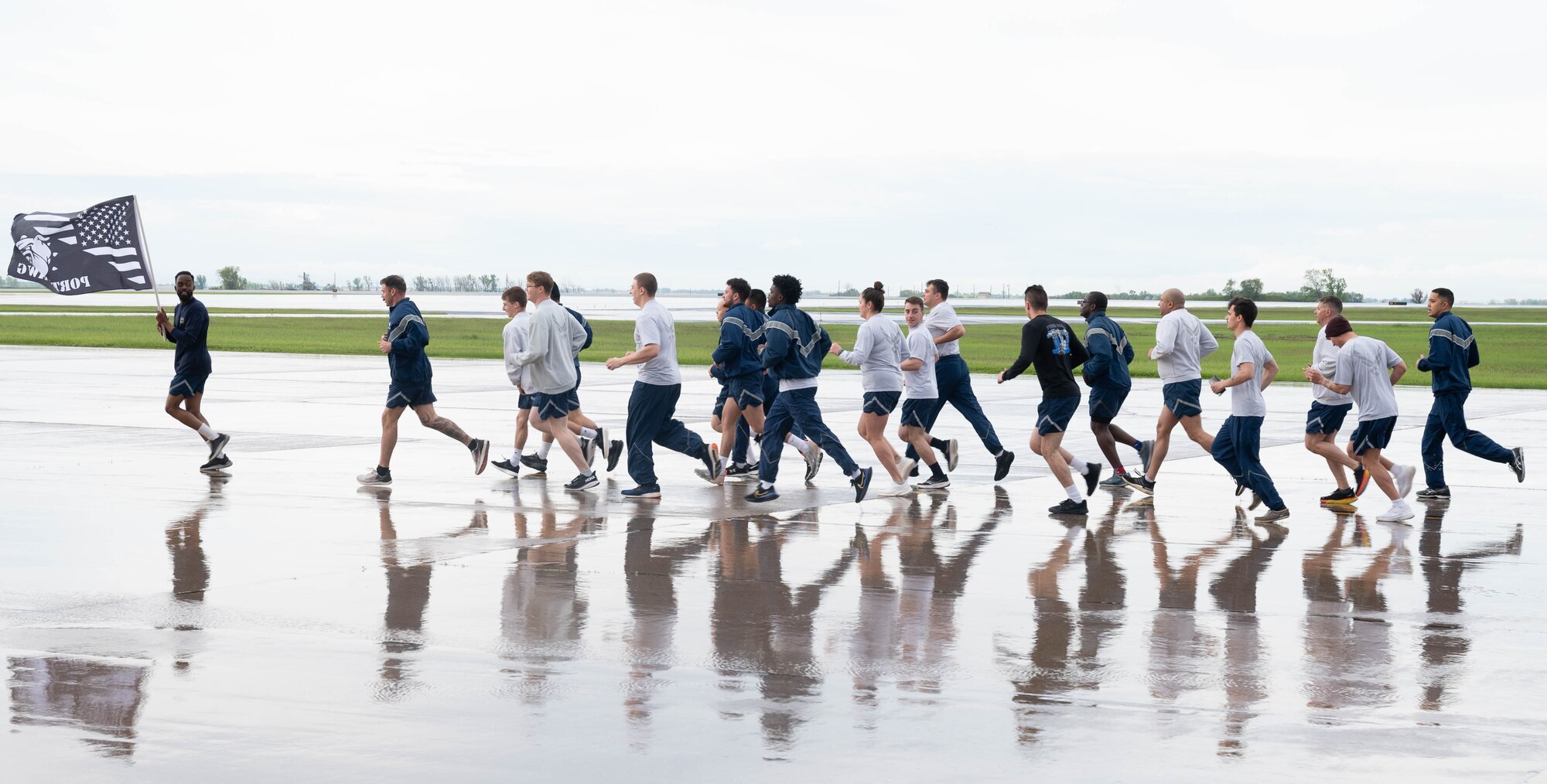 Members of the air transportation specialists community run during the 2024 Port Dawg Memorial Run at Minot Air Force Base, North Dakota, May 30, 2024. The Port Dawg Memorial Run is an air transportation career field tradition that started at Kadena Air Force Base, Japan in 2013. The loss of U.S. Air Force Tech. Sergeant Curtis E. Eccleston in 2011 is the tragic event that sparked the memorial run, which has since spread across the career field globally. (U.S. Air Force photo by Airman 1st Class Luis Gomez)