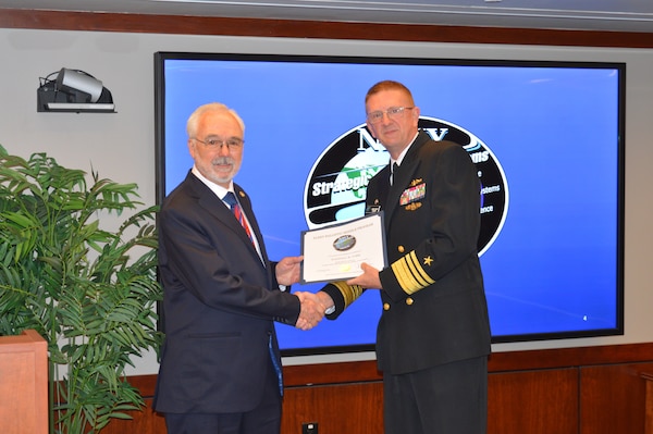 Vice Adm. Johnny Wolfe Jr., director Strategic Systems Programs, presented Mr. Randy York, Arcfield, with a 50-year FBM Service Award at the biannual Steering Task Group Meeting, 22 May. Fifty-year FBM Service Awards celebrate the career-long achievements and commitments of industry and government personnel who have support the FBM program for over 50 years. (U.S. Navy photo by Joseph Ross/Released)