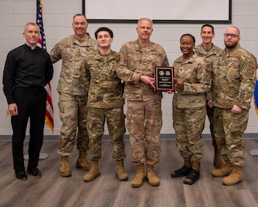 The base Chaplain Corps Team pose for a group photo at main chapel.