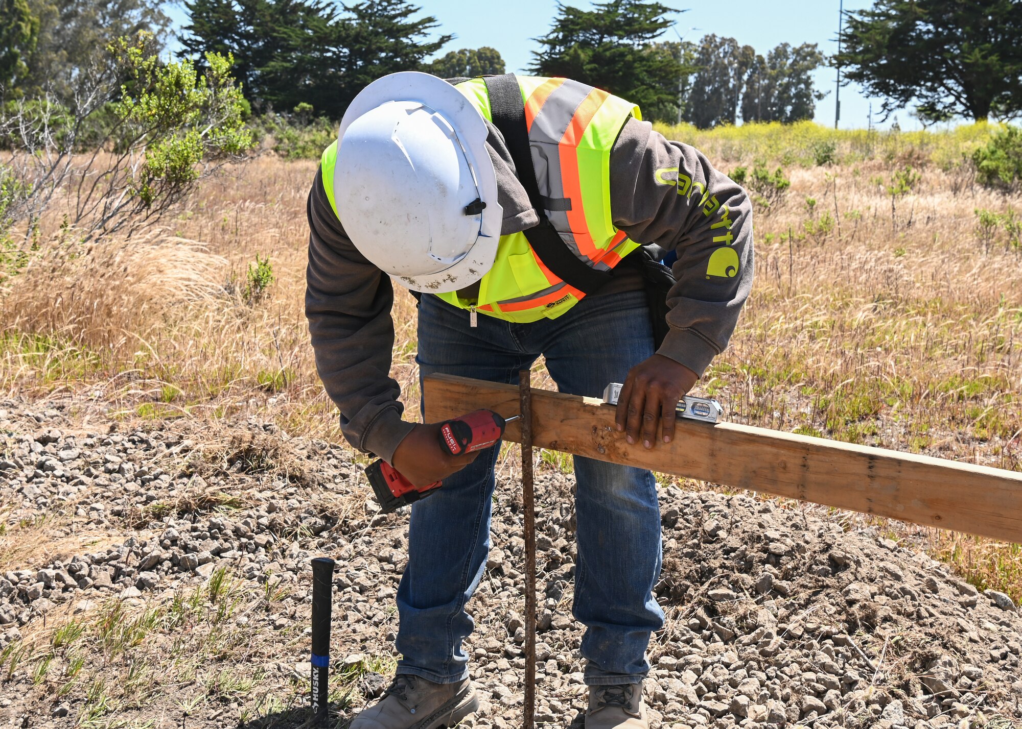 A Specialty Construction project foreman works on building a base for the new cell tower at Vandenberg Space Force Base.