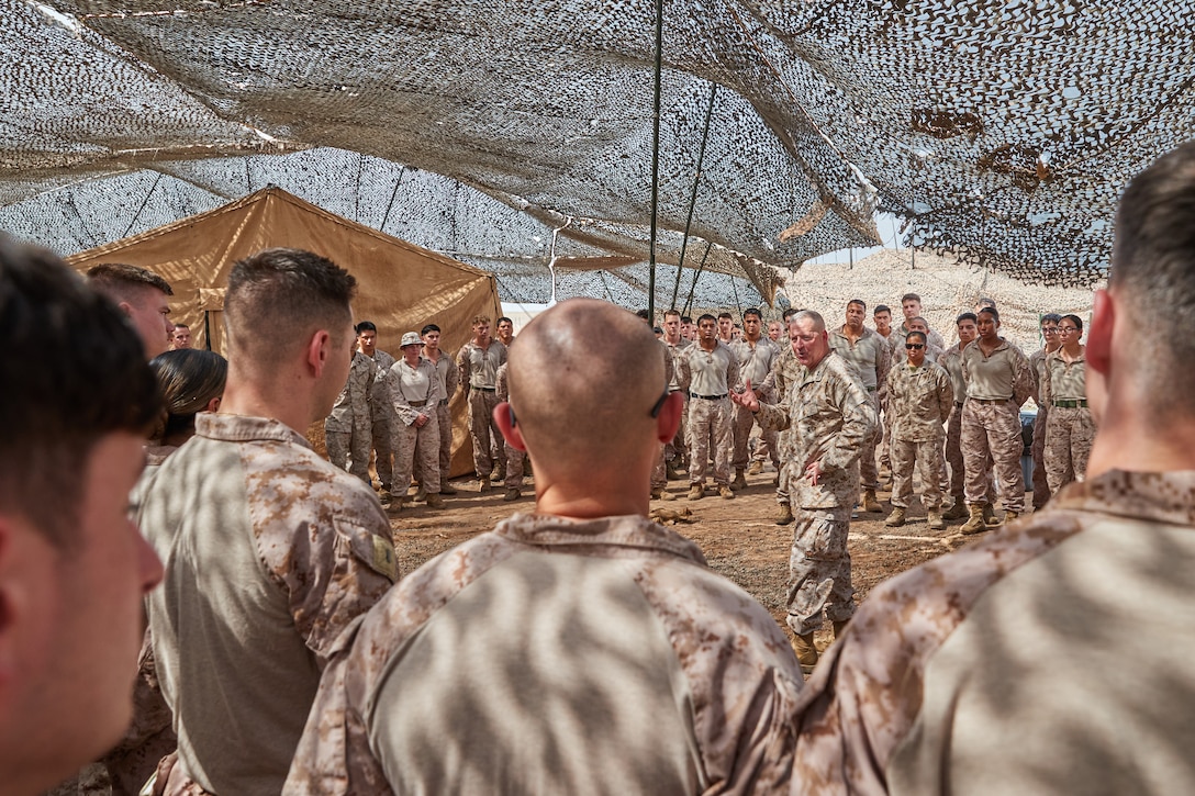 U.S. Marine Corps Maj. Gen. Robert B. Sofge Jr., Commander, U.S. Marine Corps Forces Europe and Africa, speaks to Marines assigned to Alpha and Bravo Company, Marine Air Control Squadron (MACS) 2, at Camp Lemonnier, Djibouti, on May 31, 2024. MACS-2 is essential for air command and control, air traffic management, and air defense coordination, ensuring the success of Marine Air-Ground Task Force operations by maintaining air superiority and protecting ground forces in combat and support missions. (U.S. Marine Corps photo by Cpl. Mary Linniman)