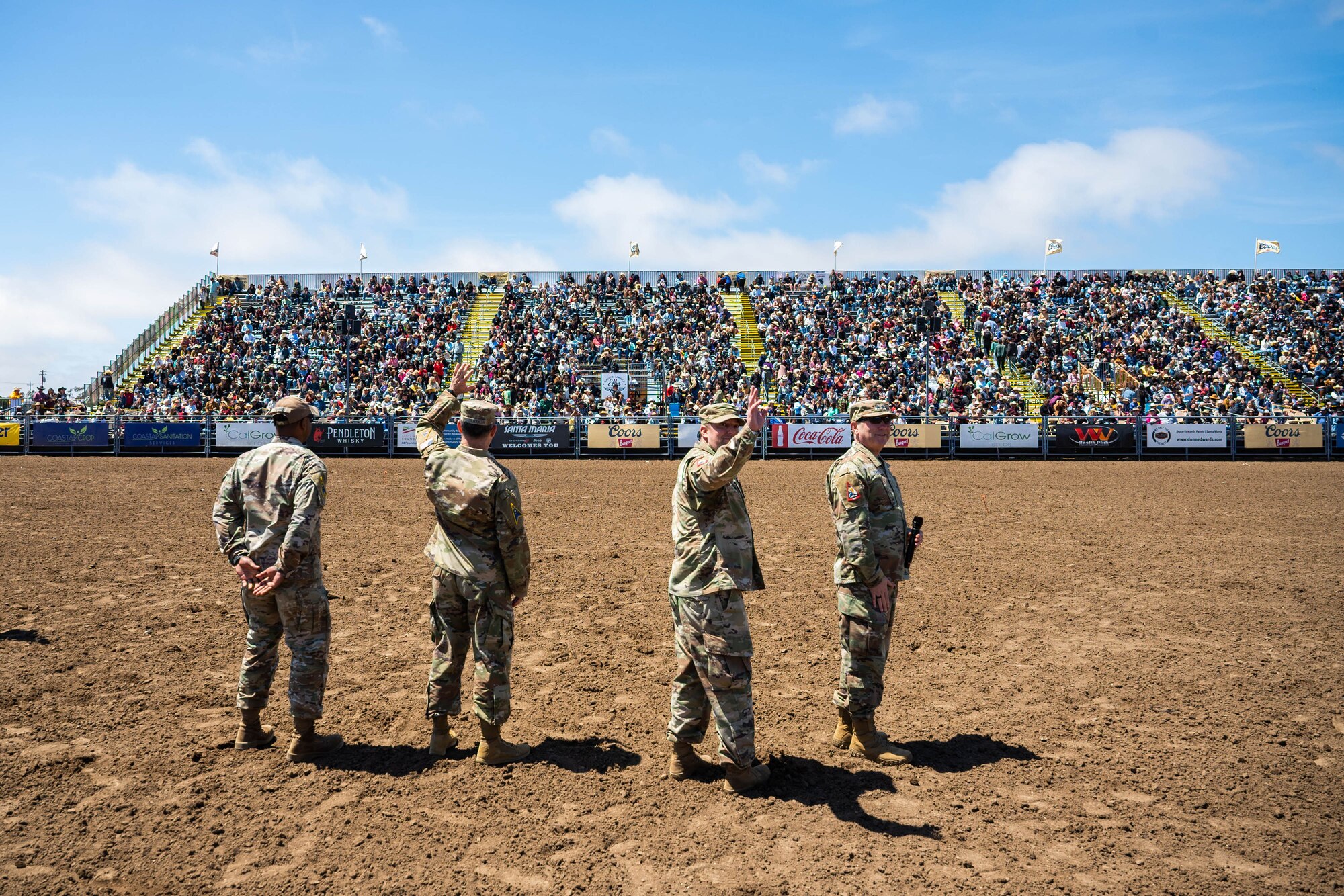 A U.S. Space Forces - Space commander and Combined Joint Force Space Component Commander, right, S4S Senior Enlisted Leader, middle-left, wave to the crowd with Space Launch Delta 30 leadership during the Santa Maria Elks Rodeo in Santa Maria.
